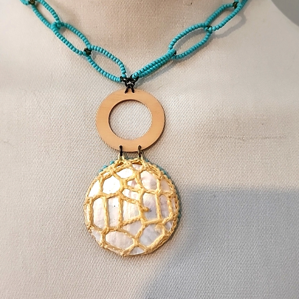 Abalone choker accented with a turquoise beaded chain.
